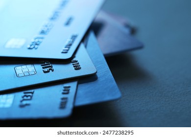 Many credit cards on dark background, closeup