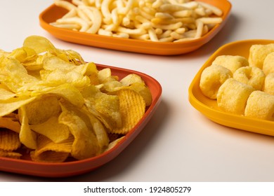 Many Crispy Snacks Food Potato Chip Salty. Fast Food Or Junk Food Snacks Unhealthy Concept.