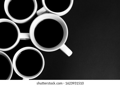 many cups of coffee on a black background.
minimalistic black, minimal, black texture, abstract black background, depth, dark mode.