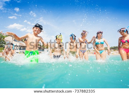 Many cute kids in sea splash fight