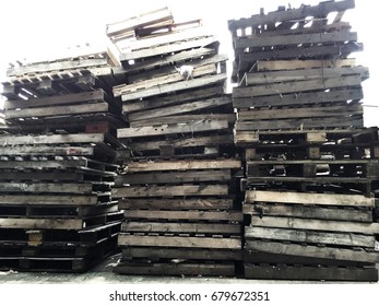 Many Damaged Pallets Come Together To Await Destruction.