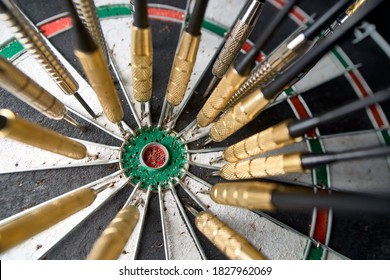 Many darts missed the center of the dartboard