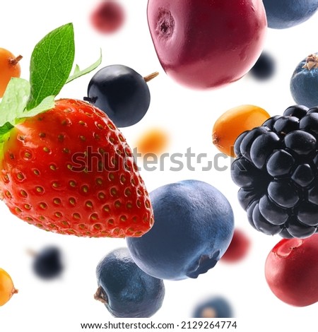Many different berries in the form of a frame on a white background