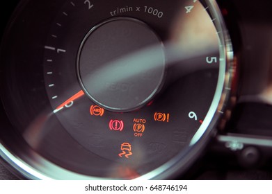 Many different car dashboard lights in closeup
