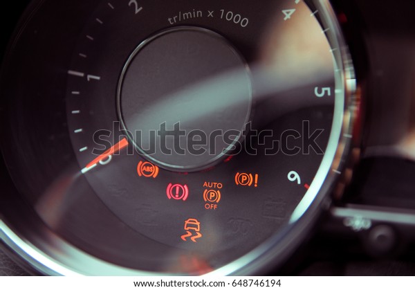 Many different\
car dashboard lights in\
closeup