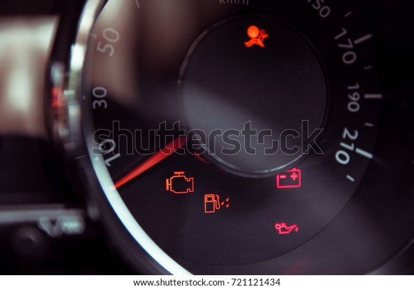 Many different
car dashboard lights in
closeup