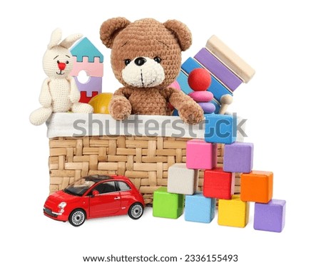 Many different children's toys and wicker basket isolated on white
