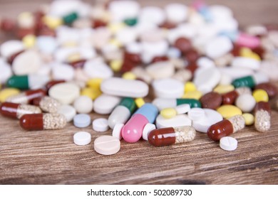 Many different colored tablets on the table