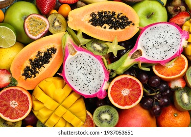Many different delicious exotic fruits as background, top view - Shutterstock ID 1937053651