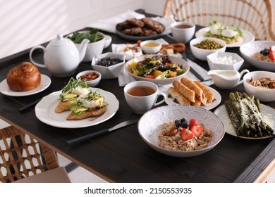 Many different dishes served on buffet table for brunch