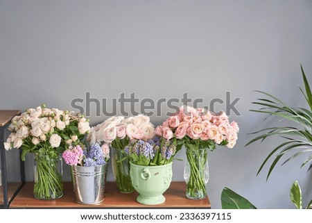 Many different flowers on Showcase. Background of mix of flowers. Beautiful flowers for catalog or online store. Floral shop and delivery concept.