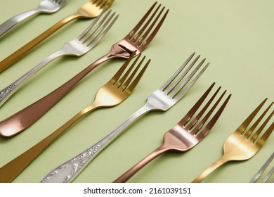 Many Different Forks On Green Background