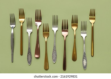 Many Different Forks On Green Background