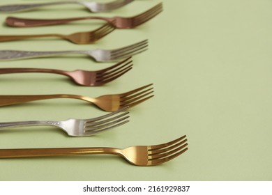 Many Different Forks On Green Background