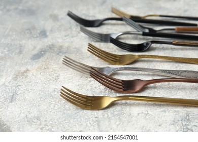 Many Different Forks On Light Background