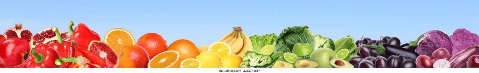 Many different fresh fruits and vegetables on light blue background. Banner design - Shutterstock ID 2282741667