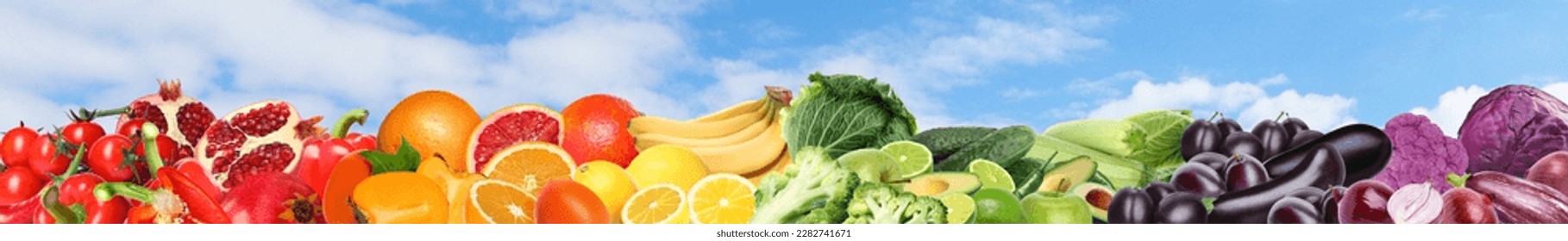 Many different fresh fruits and vegetables against blue sky with clouds. Banner design - Shutterstock ID 2282741671