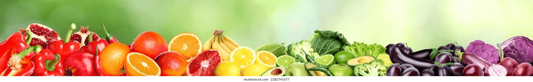 Many different fresh fruits and vegetables against blurred green background. Banner design - Shutterstock ID 2282741677