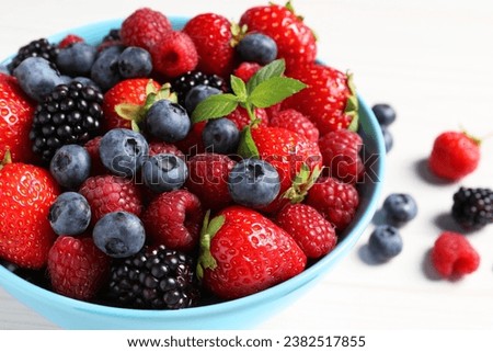 Similar – Bowl with red berries and mint leaves