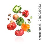 Many different fresh vegetables falling on white background