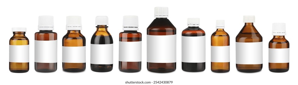 Many different glass bottles with labels isolated on white