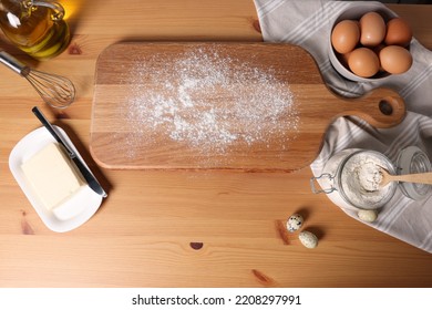 Many different ingredients for dough on wooden table, flat lay - Shutterstock ID 2208297991