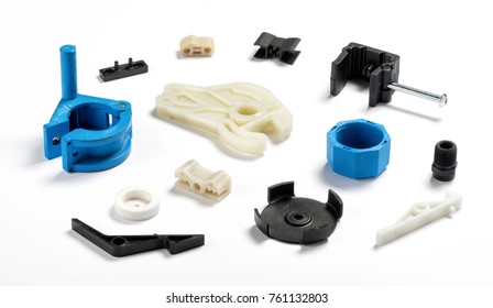 Many Different Injection Plastic Parts Of White, Blue And Black Colour Spread On White Background