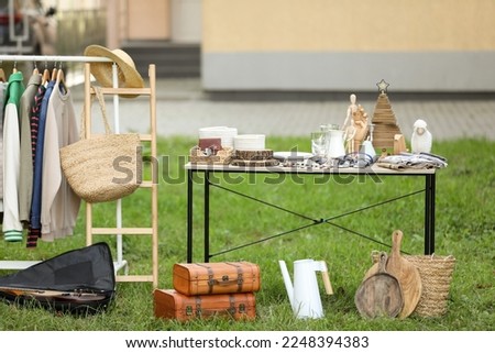 Many different items selling in yard. Garage sale