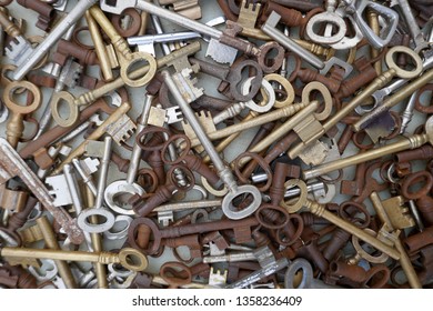 Many different old, rusty keys to sell at the flea market. Close up, background and texture.
