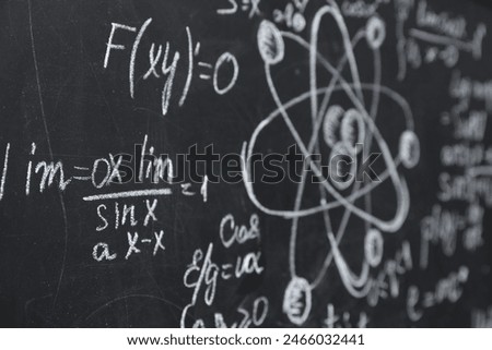 Many different physical formulas written with chalk on blackboard, closeup