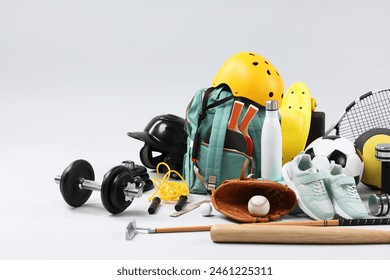 Many different sports equipment on light grey background - Powered by Shutterstock