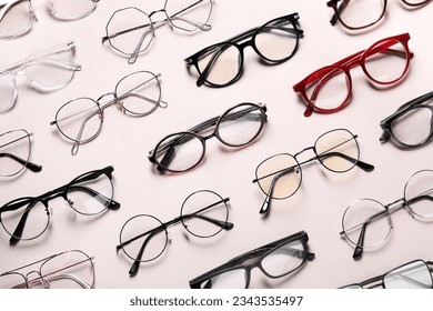 Many different stylish glasses on light grey background, flat lay - Powered by Shutterstock