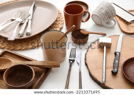Many different tableware and kitchenware on white background