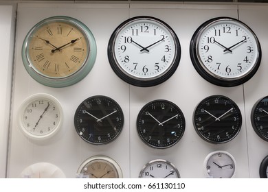 Many different wall clock on the wall