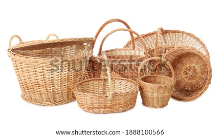Many different wicker baskets on white background