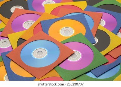Many Discs in Cases in a large Messy Pile.