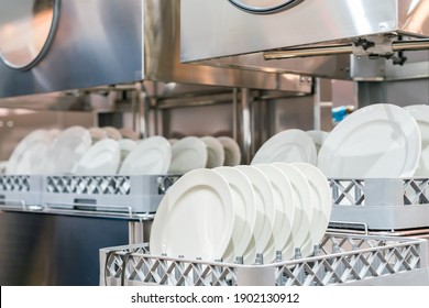 Many Dish Or White Plate Arranged On Basket For Cleaning By Automatic Dishwasher Machine In Kitchen Room Restaurant