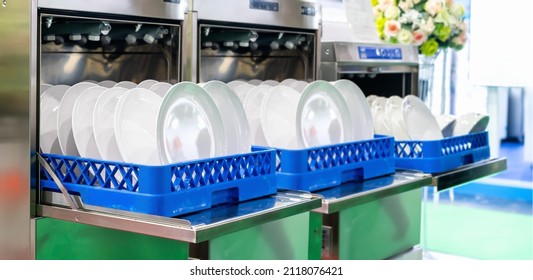 Many Dish Or White Plate Arranged On Basket After Cleaning By Automatic Dishwasher Machine In Kitchen Room Restaurant