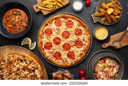Many dishes. Junk food assortiment  pizza, wok top view. - Shutterstock ID 2221526265