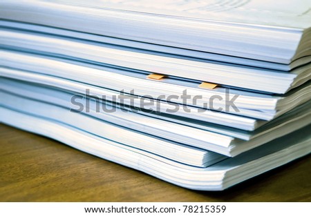 Many documents lying on a table