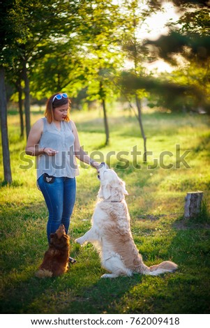 Similar – Image, Stock Photo Loving young woman offered a paw by her dog