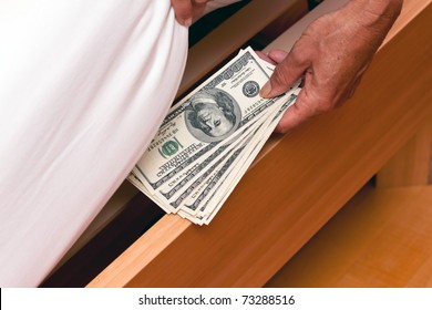 Many Dollar Bills Are Hidden Under The Bed