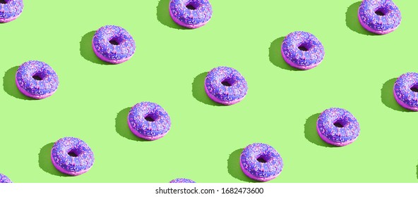 Many Donuts Square Pattern. Set Same Cakes Concept. Hard Shadow. Top View Colorful Background. Green, Purple Colors. Unhealthy Food Art. Circle Bright Dessert