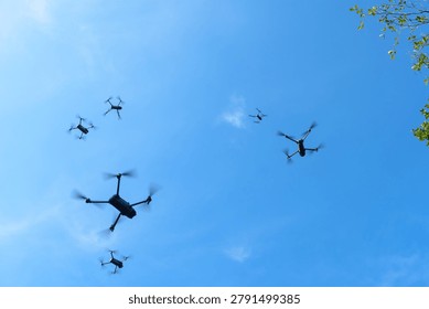 Many drone fly in the sky. Many drones fly in the sky. Drones are often used to photograph and film events.