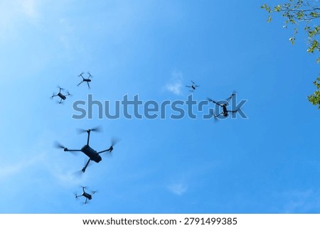 Many drone fly in the sky. Many drones fly in the sky. Drones are often used to photograph and film events.