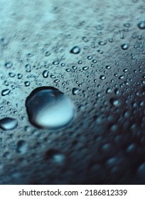 Many drops water the mirror surface  Texture for background    dark blue gradient  after rain