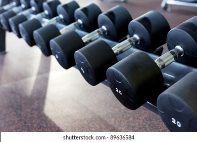 many dumbbells are at  stand at the gym
