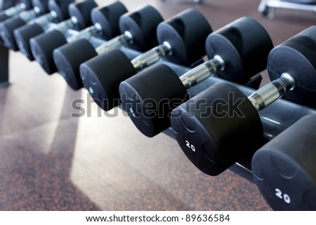 many dumbbells are at  stand at the gym
