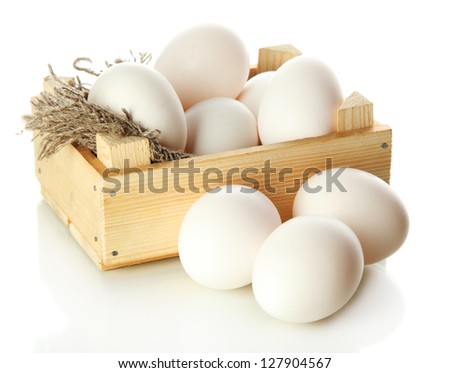 Many eggs in box isolated on white