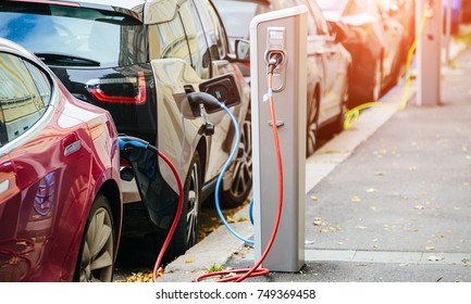 Many Electric Car Are Charged By Charging Stations In The Parking Lot